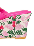 Bright pink Kolhapuri wedge sandals with double braided strap and golden stud detailing – stylish and comfortable ethnic shoes.