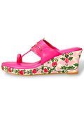 Floral thread-embroidered wedge heel of pink Kolhapuri sandals, traditional Indian design with modern twist.