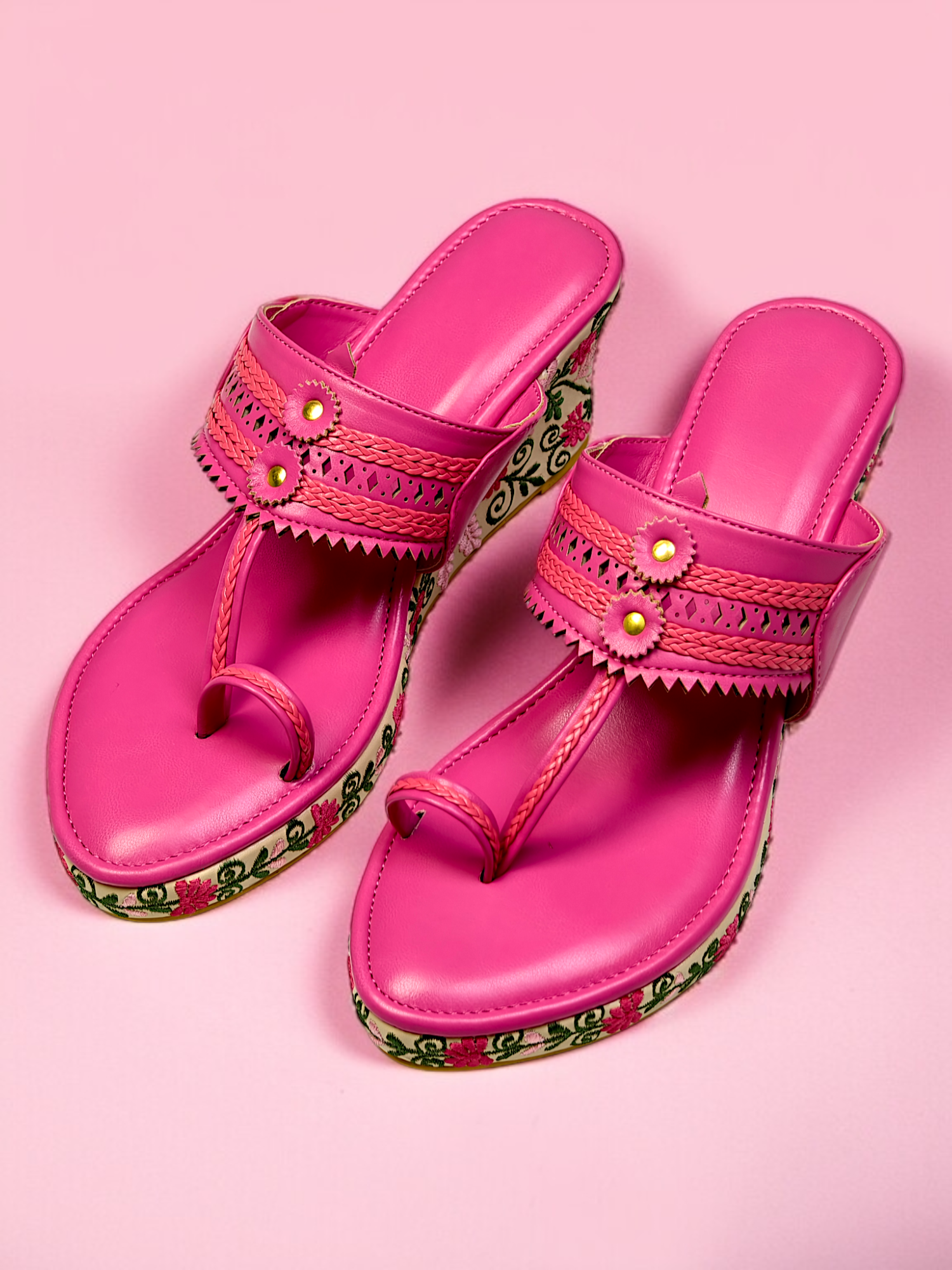 Hot pink Kolhapuri wedge sandals with floral embroidered heels and traditional braided straps – festive footwear for women.
