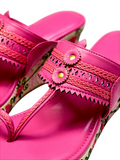 Pink ethnic wedge Kolhapuri sandals with floral wedge design and toe-ring front, perfect for Indian festive wear.